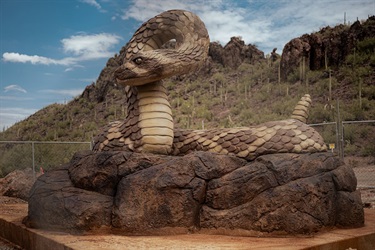 Snake sculpture on rocks