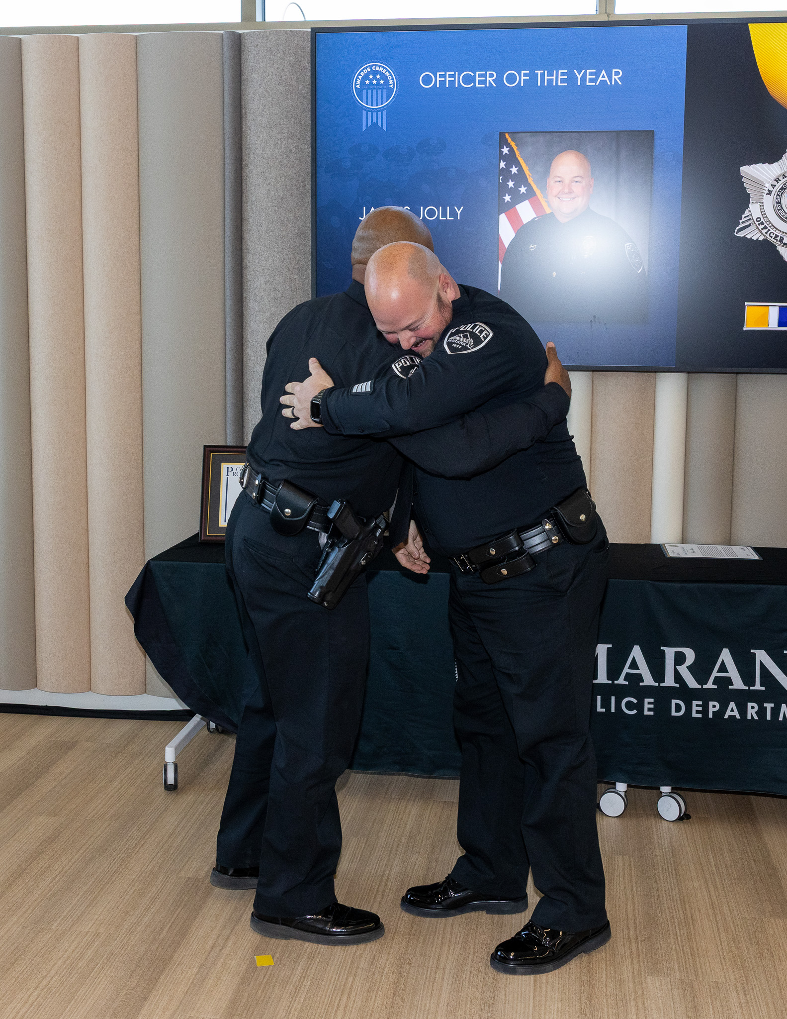 Chief Pridgett hugs Officer Jolly