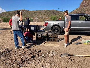 Digging up dirt for new plants at El Rio