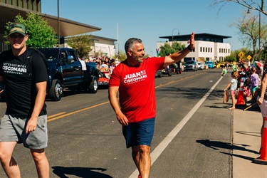 Congressman Juan Ciscomani walking parade route