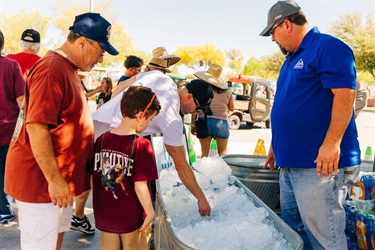 Families grabbing ice cold water