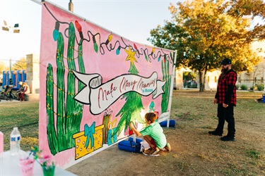 Children painting the community mural