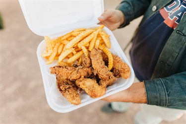Close up of chicken tenders and fries
