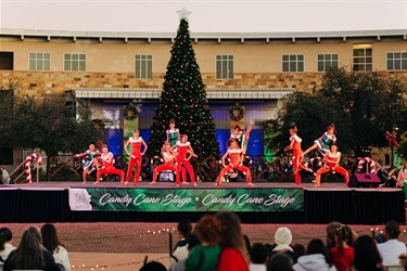Dancers in holiday inspired outfits