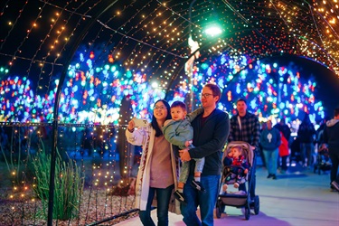 Families walking through the light tunnel