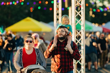 Family walking through Mistletoe Market