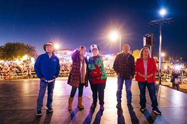 Town council members on the stage