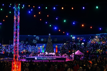 View of the Candy Cane Lane stage at night under the lights