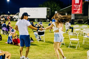 Attendees dance during the concert at event