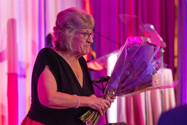 Patti Comerford with flower bouquet 