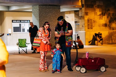 Family at Treat Trail with red wagon
